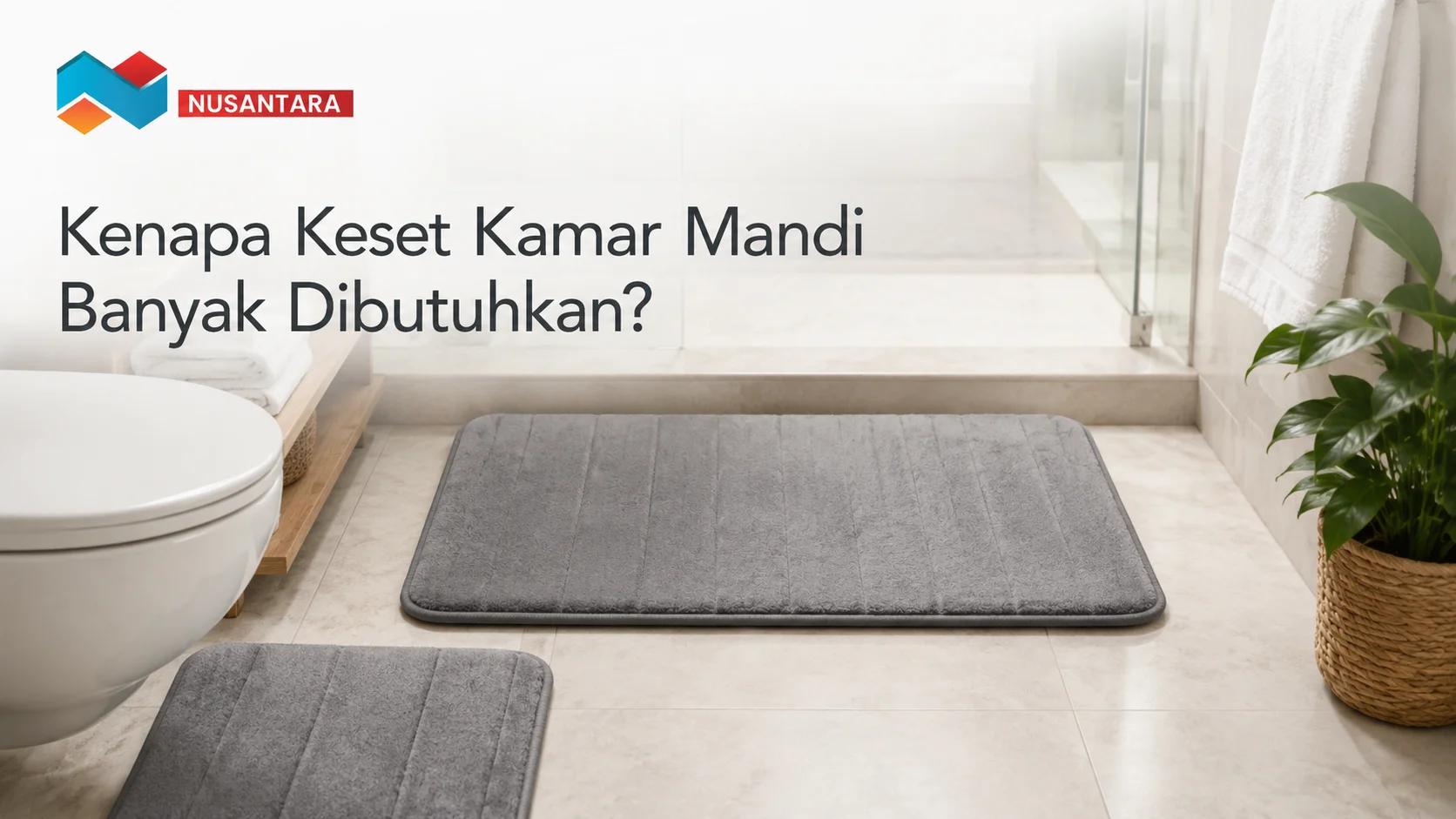 Keset kamar mandi abu-abu berkualitas di kamar mandi modern yang bersih dan minimalis.